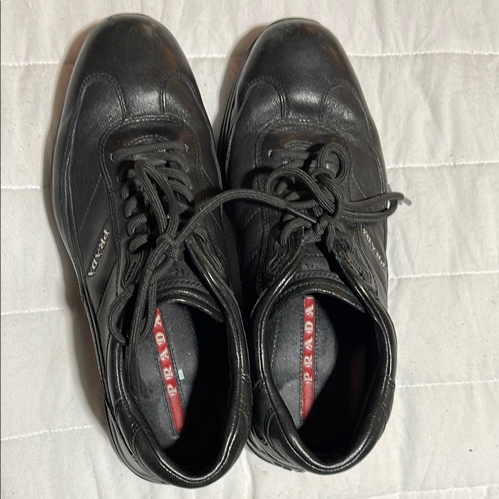 Prada Black Sneakers with Lace-Up Design and Versatile Style